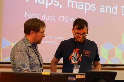 Adam and Gregory checking the slides are ready