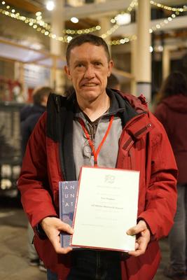 Tom Hughes with his certificate and prize for the Ulf Möller Memorial Award
