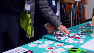 Designs are selected to be made into badges