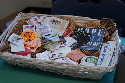 A basket of stickers for delegates to take or swap
